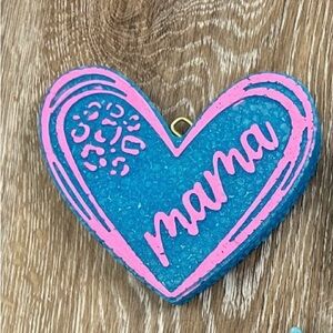 Blue and pink “Mama” heart car freshie. Coconut and mahogany scented.